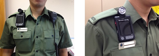 Hong Kong police on military green shirt wearing a body camera