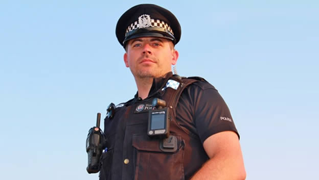 Policeman wearing body camera looking from above